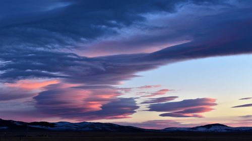 Scenic view of dramatic sky during sunset