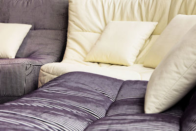 Close-up of cushions on sofa at home