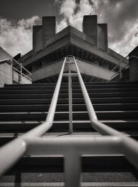 Low angle view of staircase in building against sky