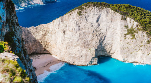 High angle view of cliff by sea