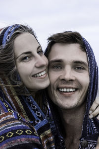 Close-up of cheerful couple standing outdoors