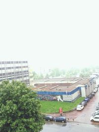 High angle view of buildings in city against clear sky