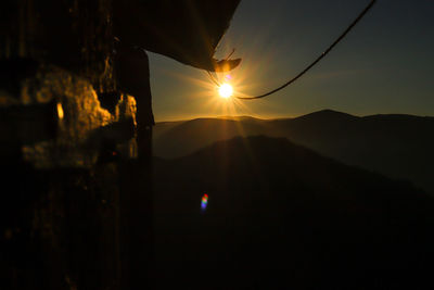 Silhouette mountain against sky during sunset