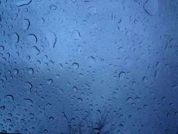 Close-up of water drops on glass