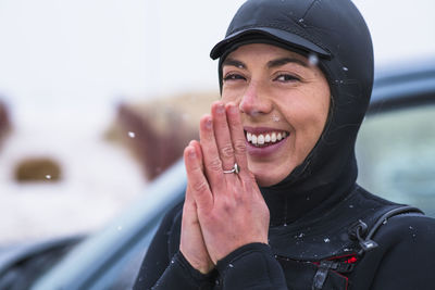 Young woman going winter surfing in snow