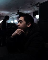 Side view of young man looking away