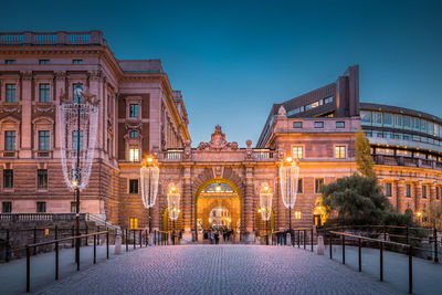 Illuminated parliament house at dusk