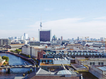 Distant view of fernsehturm amidst cityscape