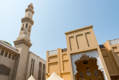 Low angle view of buildings against clear sky