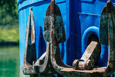 Close-up of blue tied up on metal boat