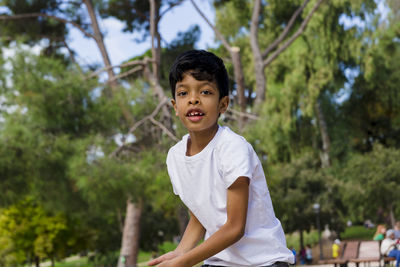 Young boy alone. having fun in a park.