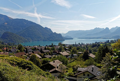 High angle view of townscape and bay against sky