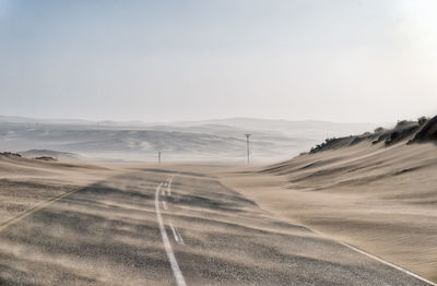 Scenic view of desert against clear sky