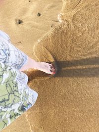 Low section of woman on beach