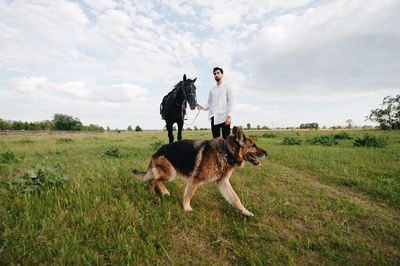 Man riding horse on field