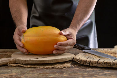 Midsection of man preparing food