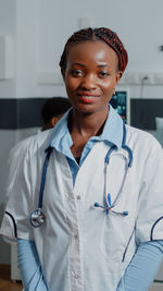 Portrait of doctor standing in clinic
