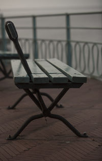 Close-up of empty chair on table