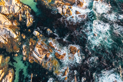 Sea waves splashing on rocks