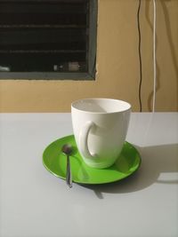 High angle view of coffee cup on table