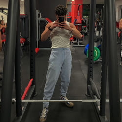 Low section of man exercising in gym