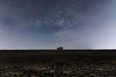 Scenic view of field against sky at night