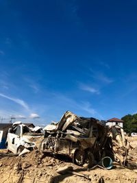 Abandoned vehicle against the sky