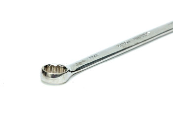 Close-up of metallic object over white background