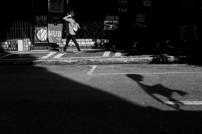 Man walking on street in city