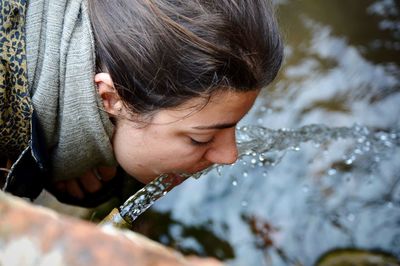 Close-up portrait of woman in water