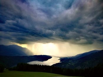 Scenic view of mountains against dramatic sky