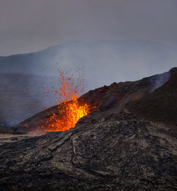 Scenic view of volcanic mountain against sky