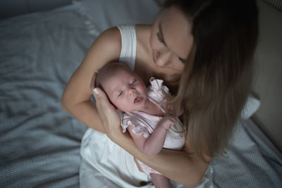 High angle view of mother and daughter at home