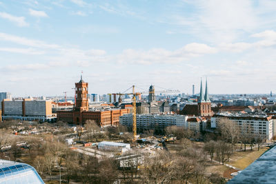 High angle view of buildings in city against sky