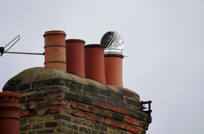 Low angle view of smoke stack against sky