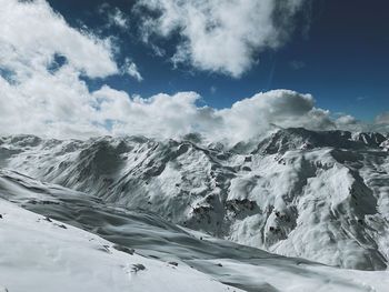 Scenic view of snowcapped mountains against sky