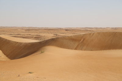 Scenic view of desert against clear sky