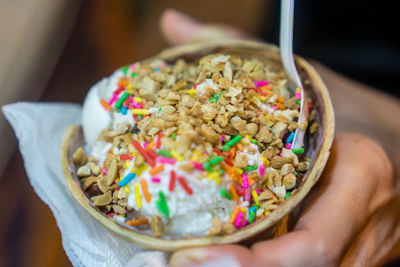 Cropped hand of person holding dessert