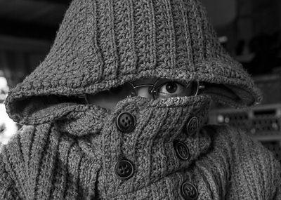 Close-up portrait of a kid, wearing knitted hat during winter