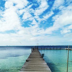 Pier over sea against sky