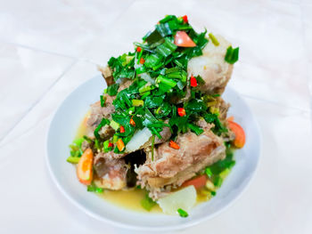 High angle view of salad in plate on table