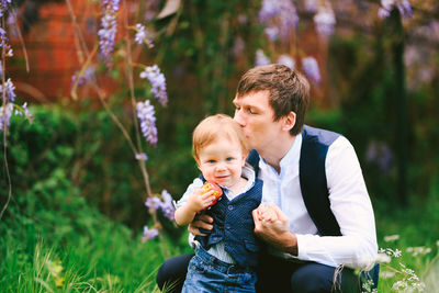 Happy mother and son with plants