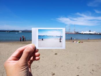 Cropped image of man standing on beach