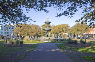 View of statues on street in city