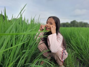 Girl playing in the rice fields