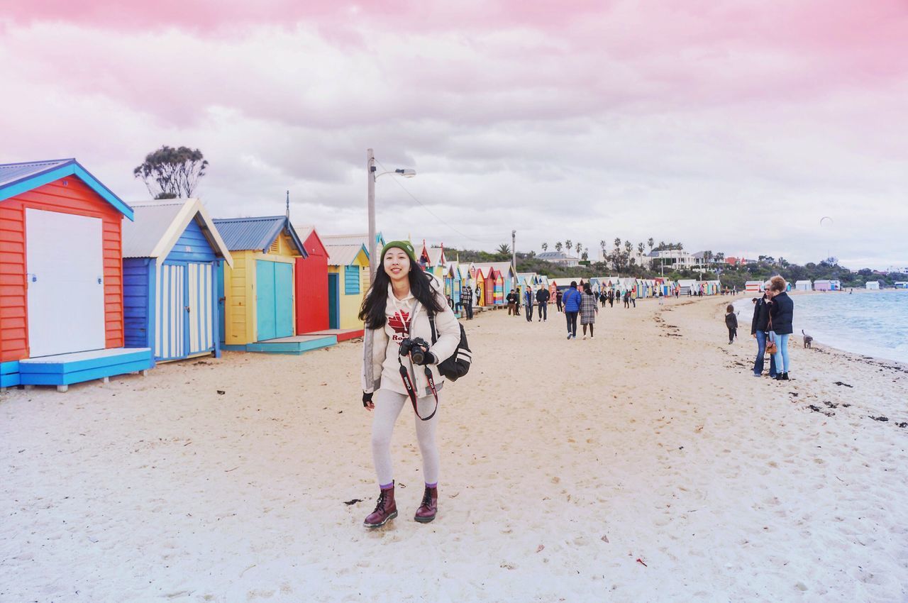 sky, men, lifestyles, cloud - sky, beach, sand, leisure activity, person, cloudy, walking, full length, cloud, large group of people, transportation, built structure, building exterior, architecture, shore, day