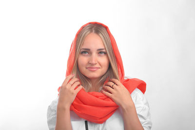 Portrait of a beautiful young woman against white background