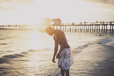 Silhouette of man standing on beach