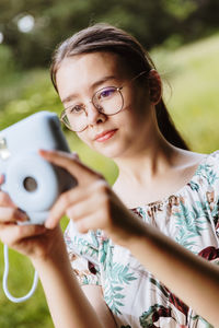 Young woman using mobile phone