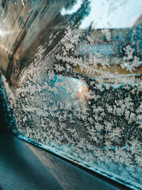 Close-up of snow covered car
